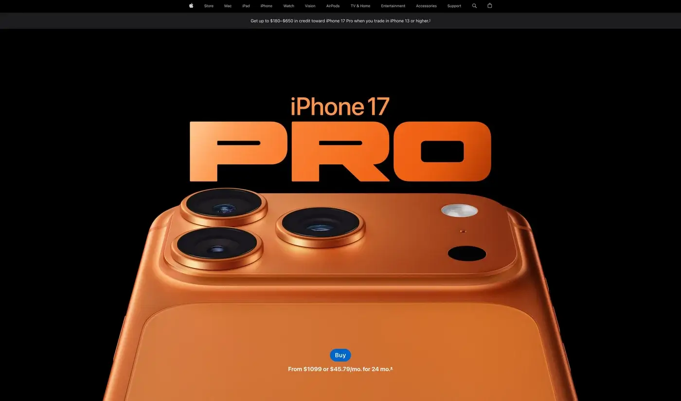The image shows the back of an orange iPhone 17 Pro with three camera lenses and a flash, set against a black background. Large text above reads "iPhone 17 PRO." A blue buy button and price below highlight premium website design quality. - Victoria website design